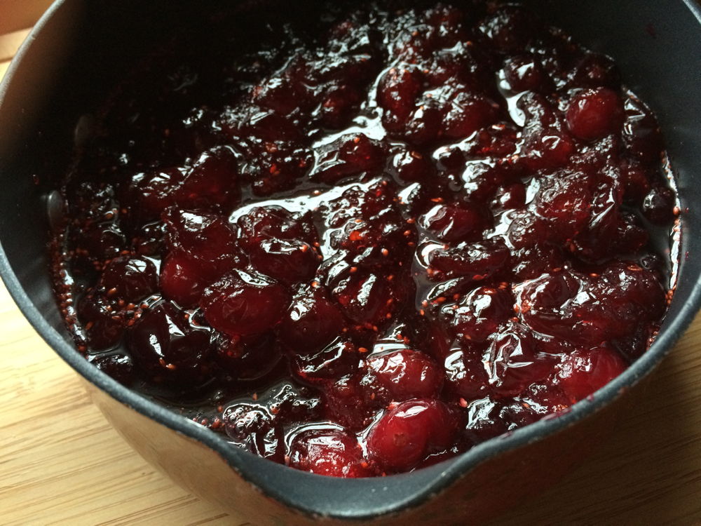 A pot of cranberry sauce.