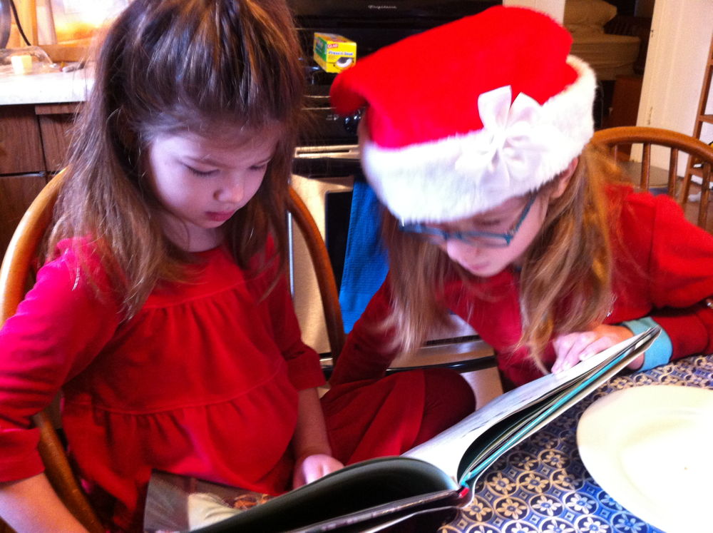 Lucy and Rosie reading.