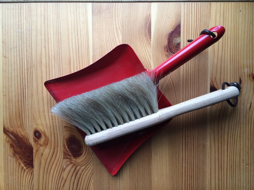 Whisk broom and dust pan.